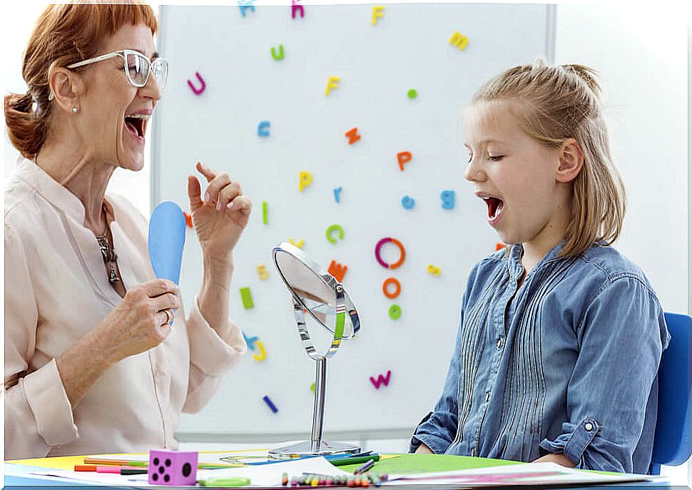 Girl at the speech therapist to help her with her language problems.