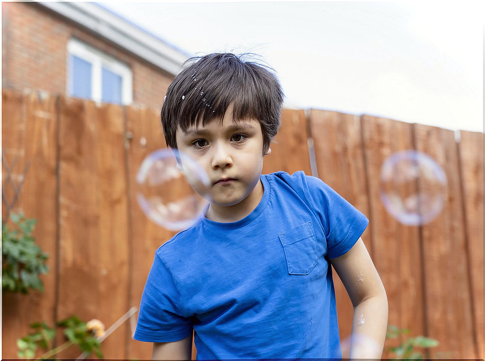 Child playing with soap bubbles.