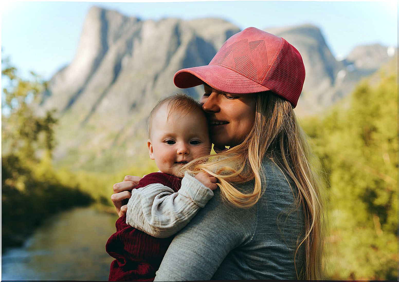 Mom with her baby in the mountains.