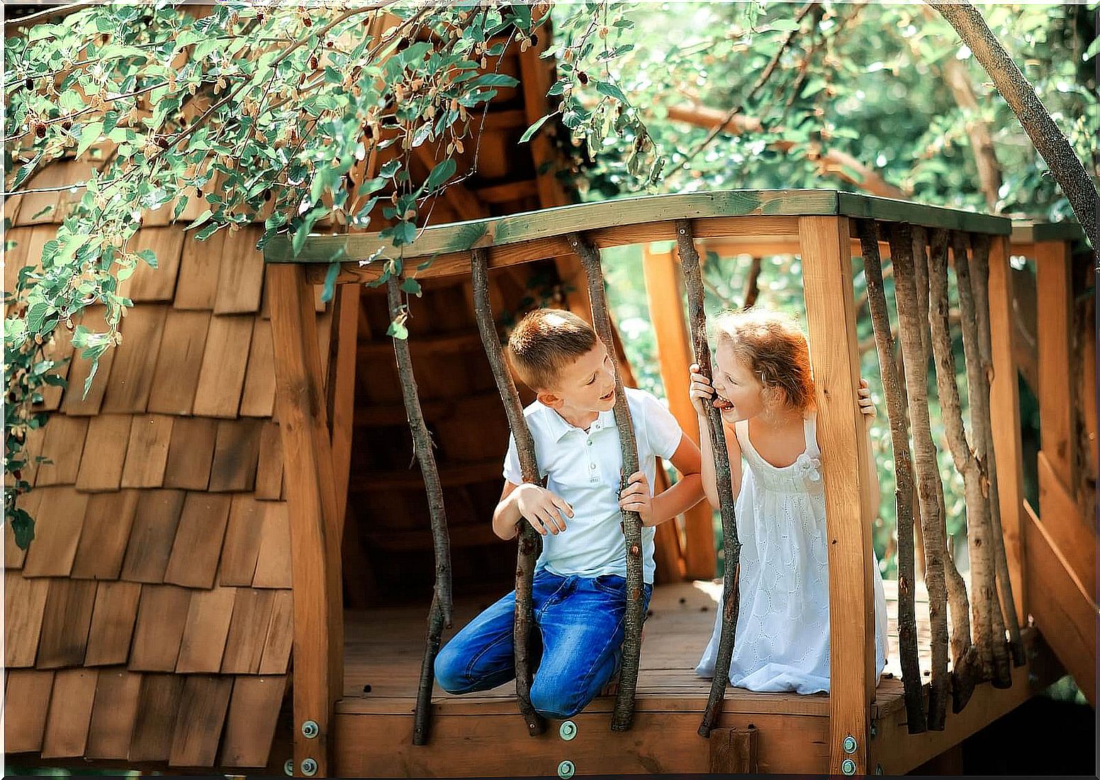 Boy playing hide and seek in the forest cabin after raffling before playing.