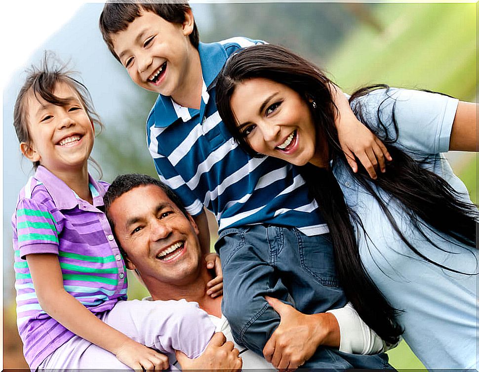 Happy family walking through the countryside and thinking about how the mandates influence the education of their children.