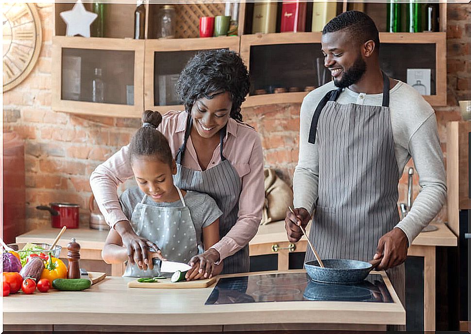 Family cooking together and setting an example.