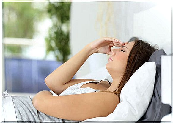 Pregnant woman with nausea resting