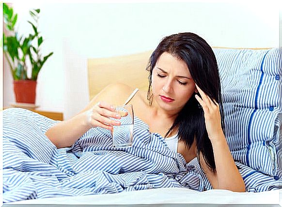 Nauseated pregnant woman drinking water