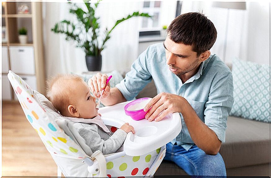 Father feeding his baby.