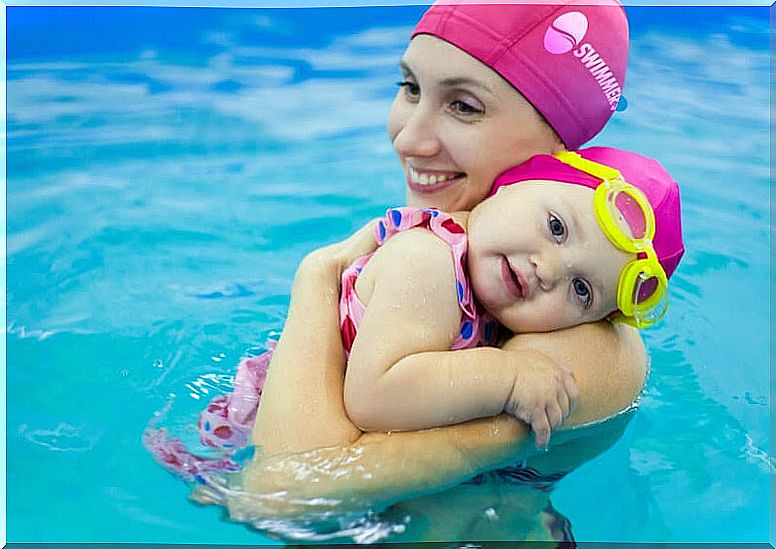 mom with baby in pool