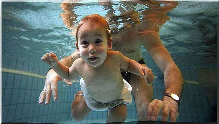 baby with dad in pool