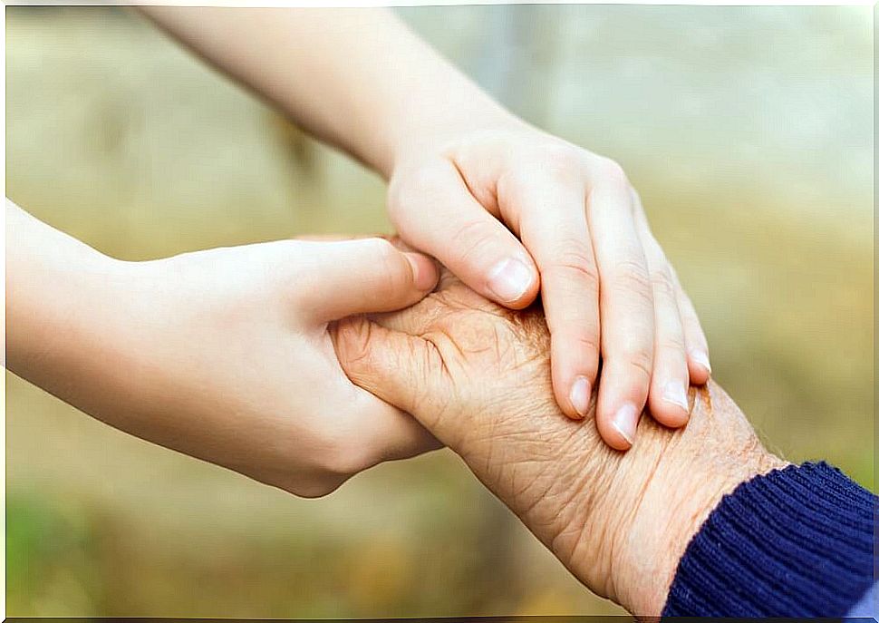 Grandson shaking hands with his grandfather and showing mutual respect.