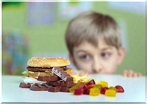 Child looking at chocolate and sweets.