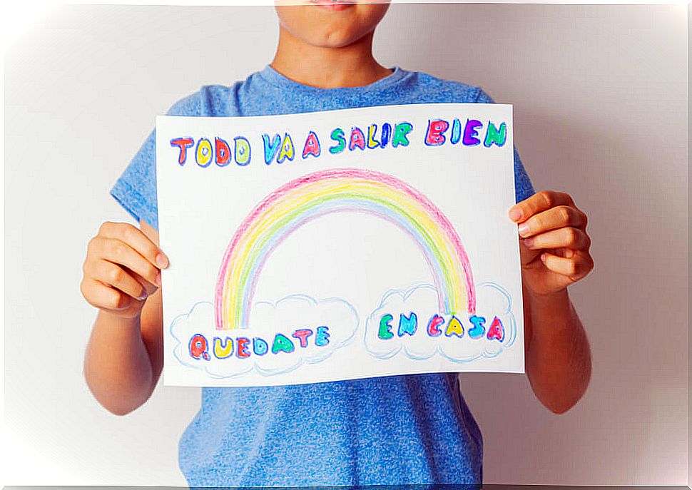 Child with a poster showing solidarity for the coronavirus.